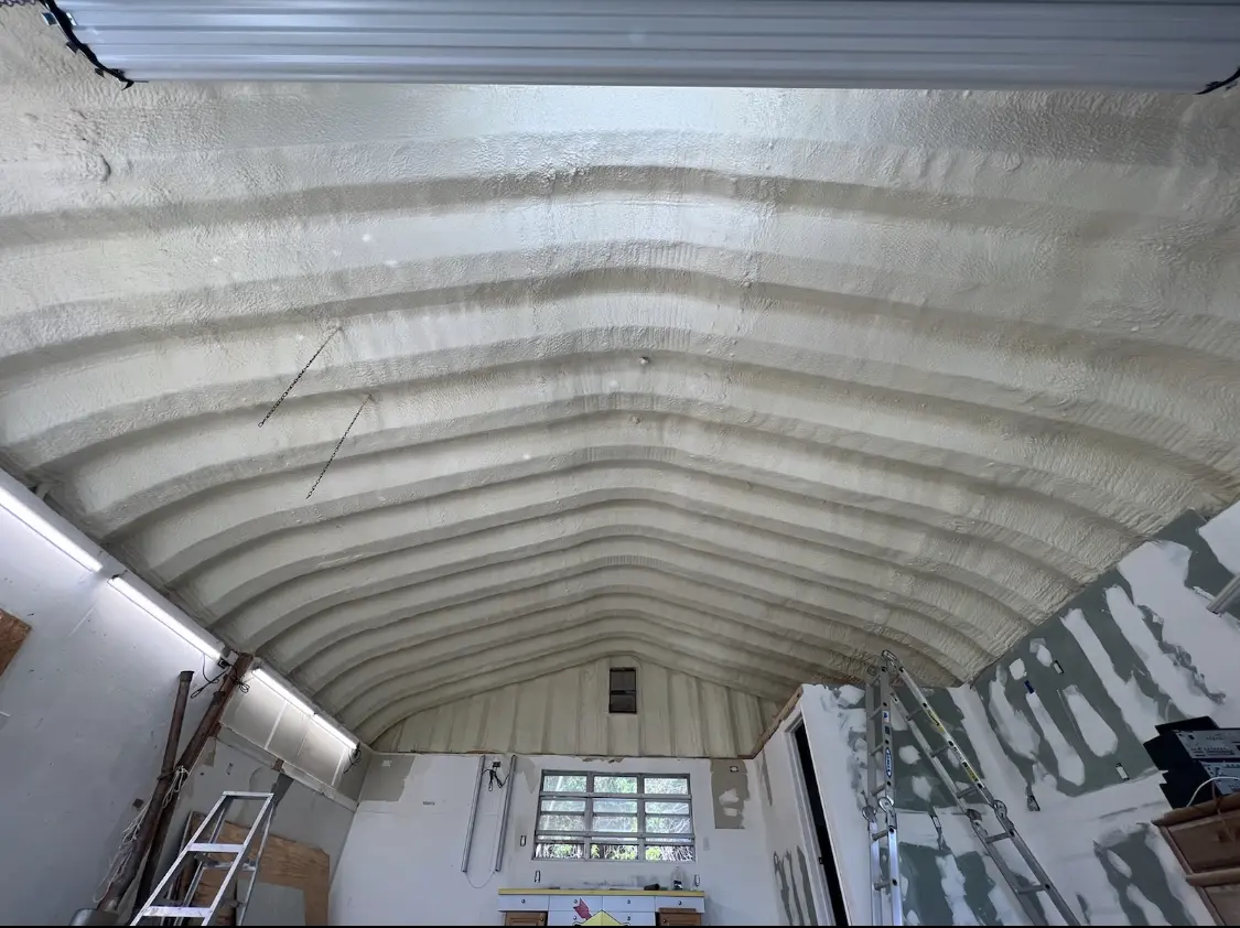 Spray polyurethane foam applied to the underside of a metal roof deck in Montrose